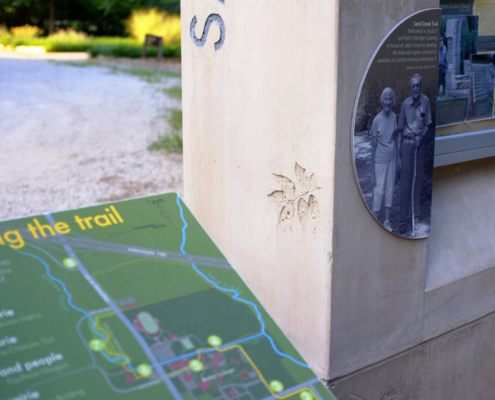 Trail Stories close up of Large concrete structures with interpretive panels attached