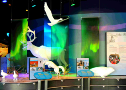 Indoor zoo exhibit featuring white animal sculptures and CHPL panels