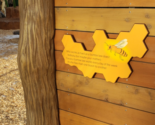 Cut to beehive shape interpretive on playscape