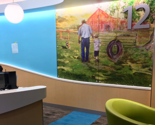 Texas Children's Hospital Wall panels in reception area featuring farm family images