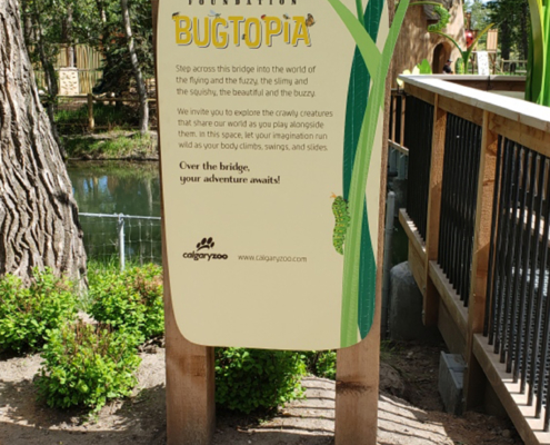 Upright cut to Shape Sign featuring graphics and Bugtopia Identity text